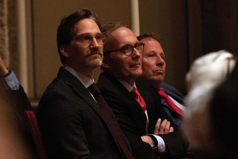 a group of men sitting in a room