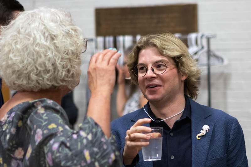 a man holding a glass of water