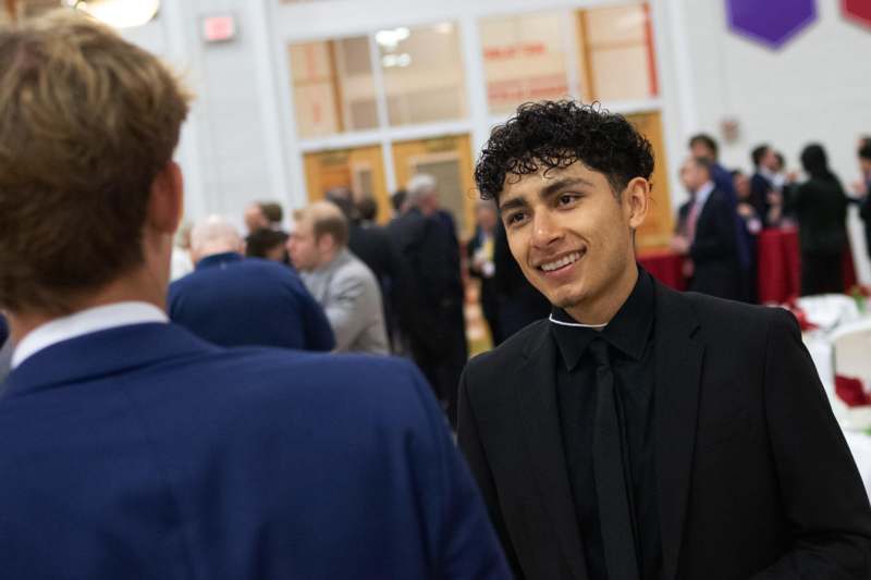 a man in a suit smiling