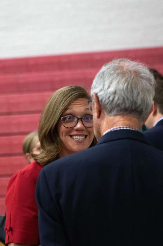 a woman smiling at a man