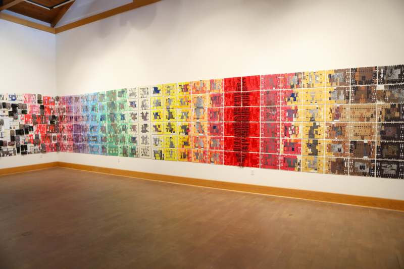 Akirash Art Exhibition Class Visit - a wall with many pieces of art on it