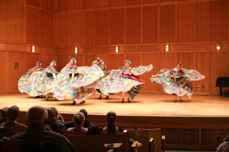 a group of women dancing on a stage