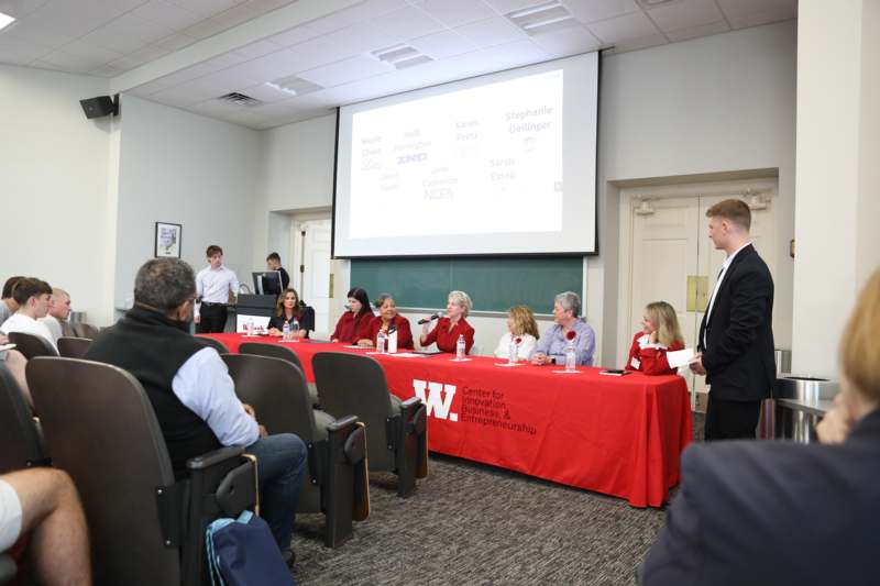 Women's Collective April 2026 Meeting - a group of people sitting at a table