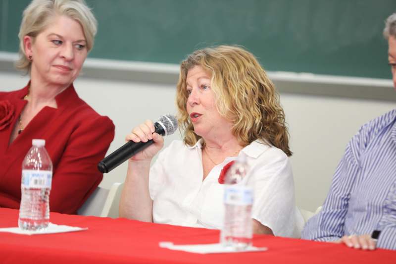 a woman holding a microphone