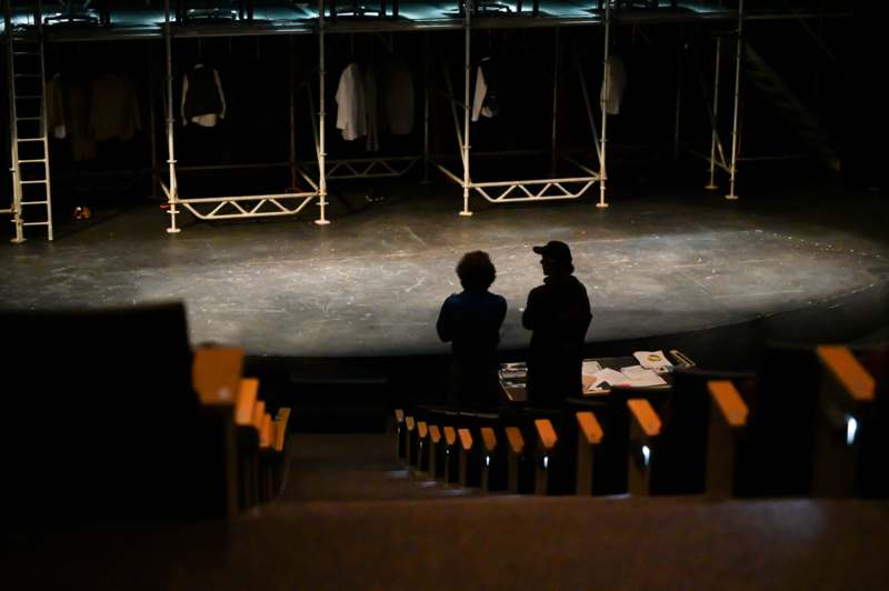people standing on a stage looking at a stage