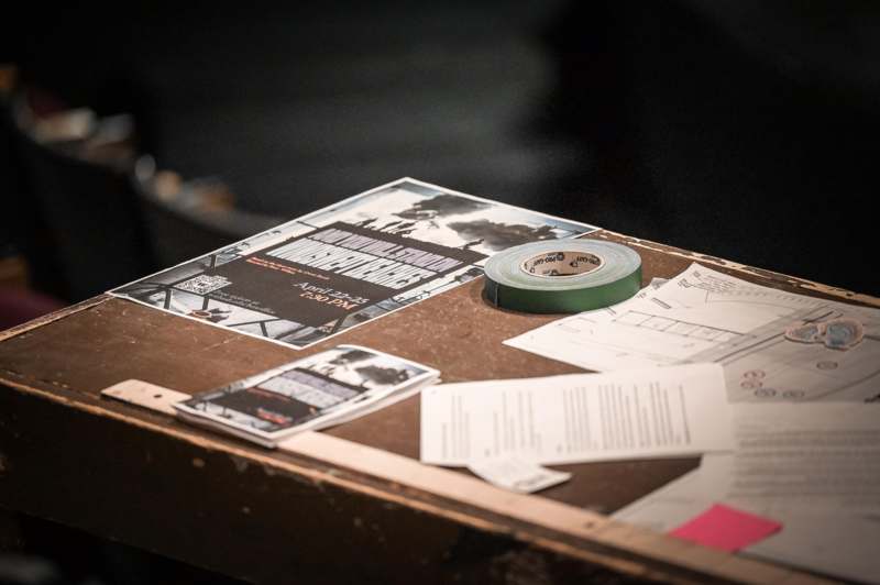 a tape roll and papers on a table