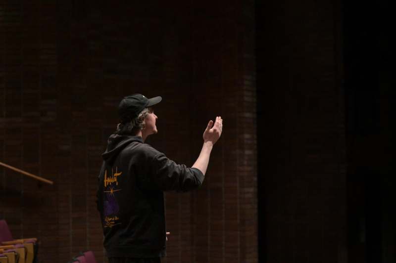 a man in a black hat