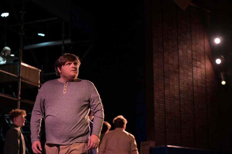 a man standing in front of a building