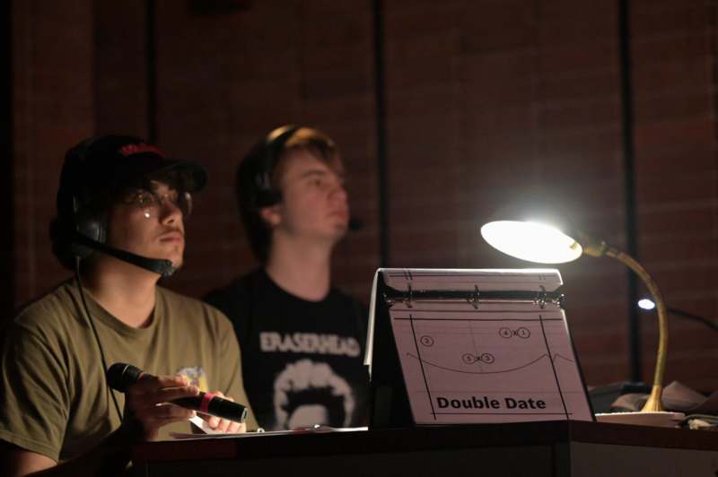 a man in a hat with a microphone and a man in a hat with a microphone