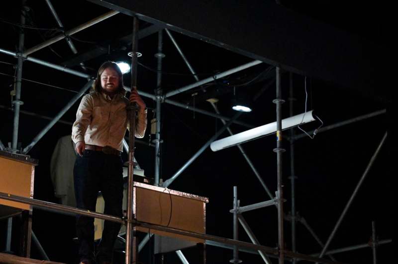 a man standing on a scaffolding