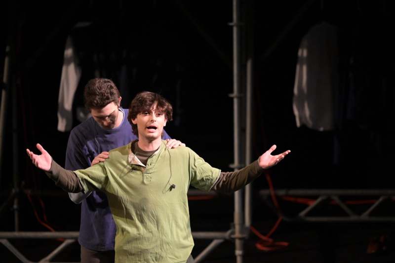 a man holding his arms out to the side of a man