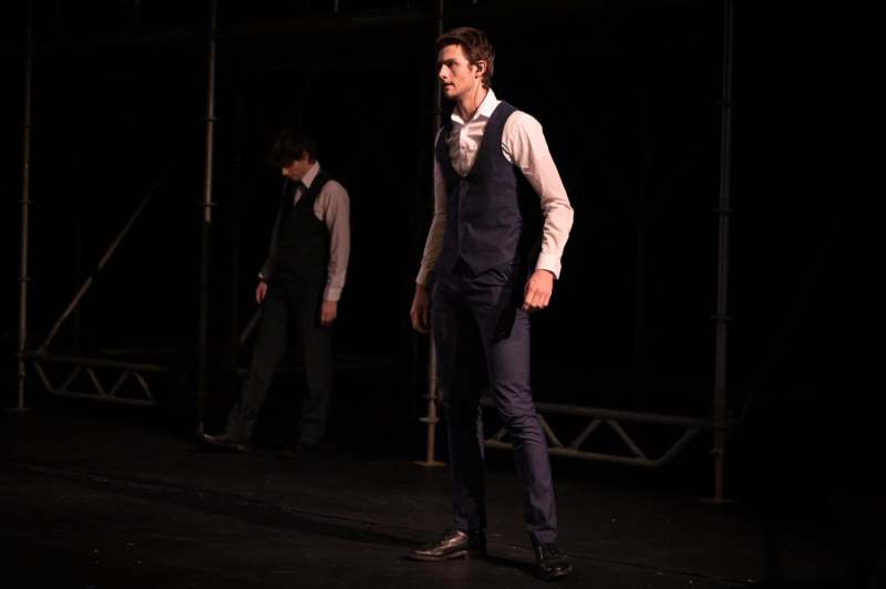 a man in a vest and tie