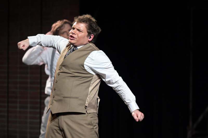 a man in a vest and tie