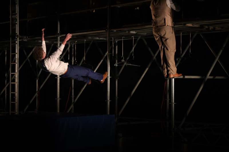 a man falling off a metal structure