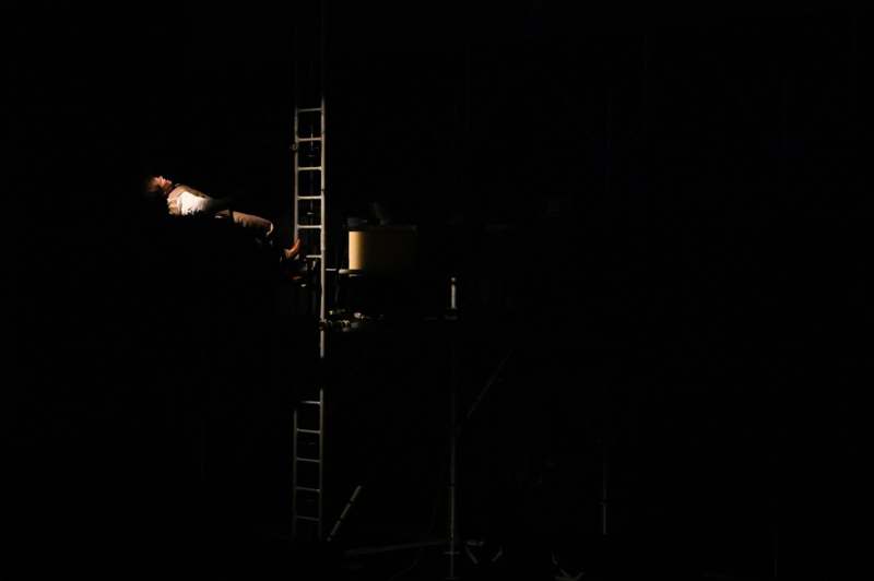 a man sitting on a ladder