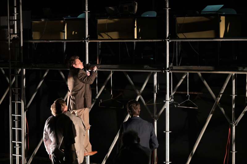 a man standing on a metal structure