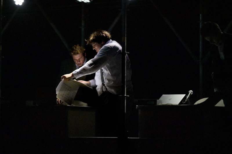 a man looking at a piece of paper