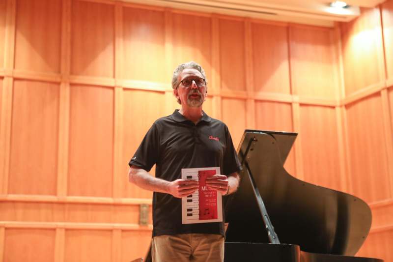April 2026 Student Recital - a man holding a sheet music