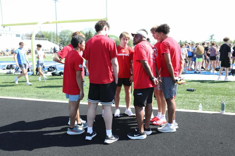 a group of people standing on a field