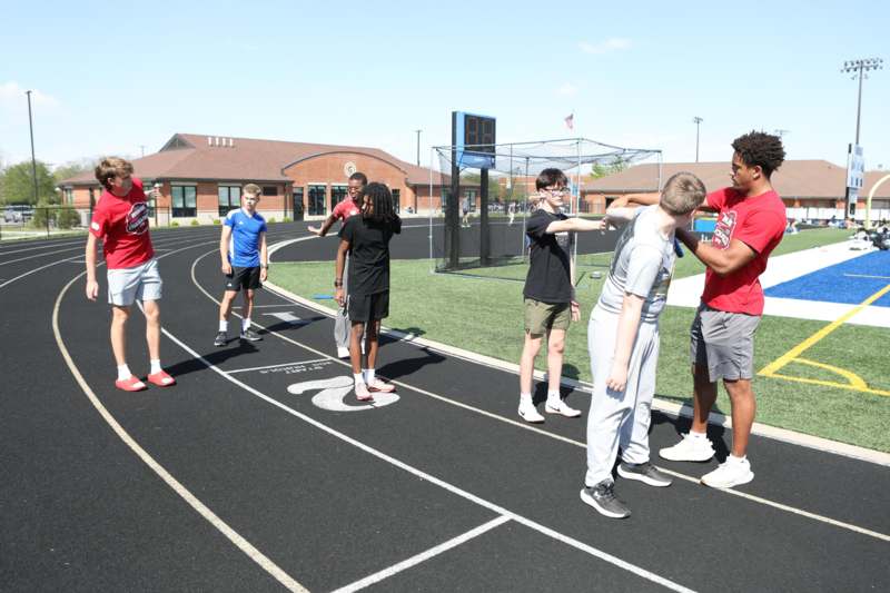 a group of people on a track