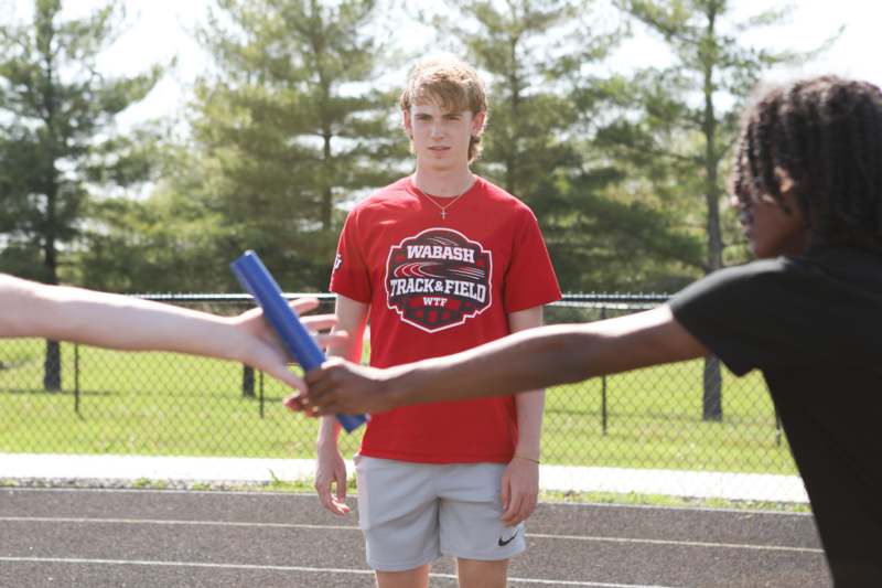 a group of people holding batons