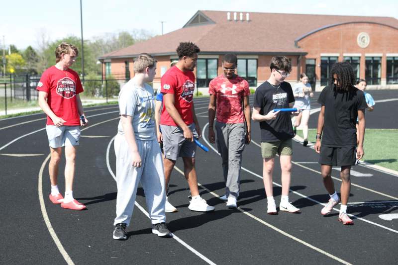 a group of people standing on a track