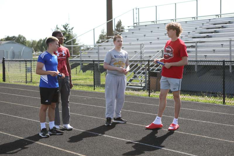 a group of men standing on a track