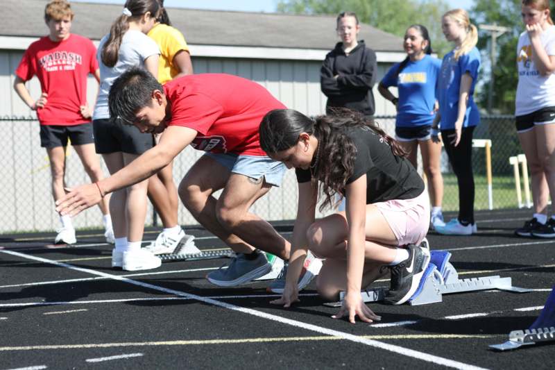 a man and woman on a track