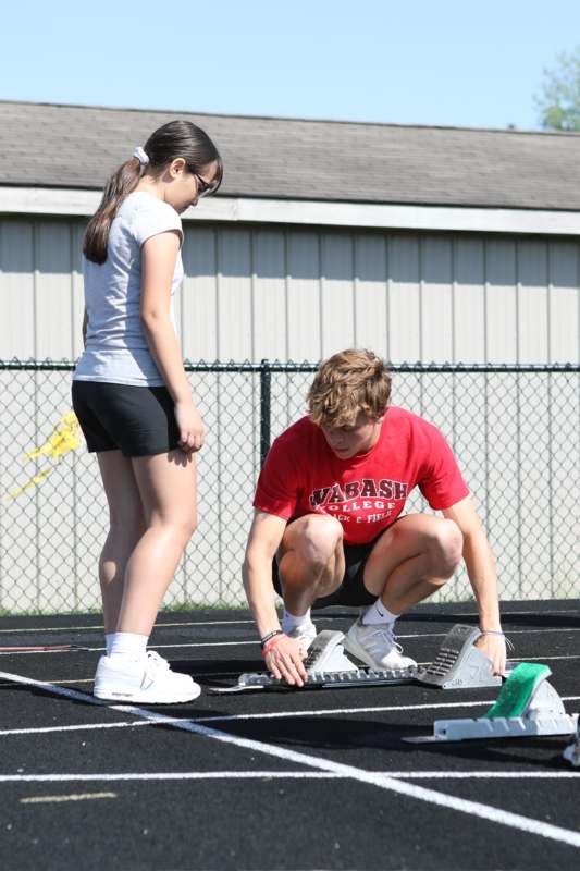 a man and woman on a track