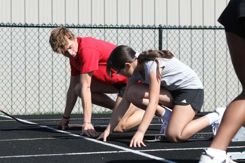 a man and woman on a track