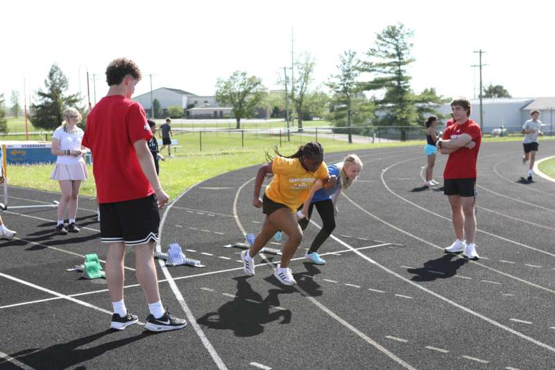 a group of people on a track