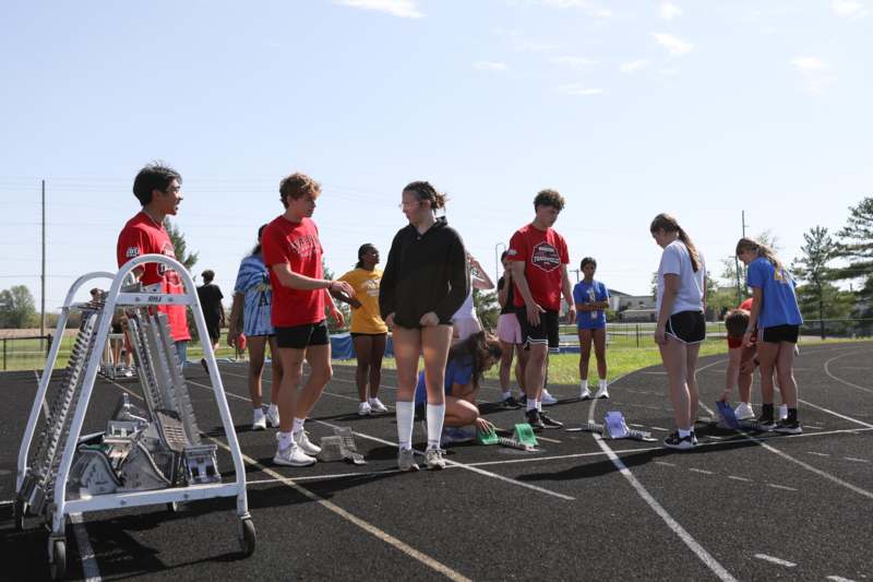 a group of people on a track