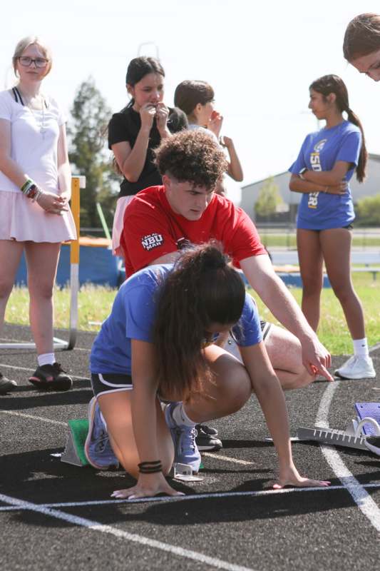 a man and woman on a track