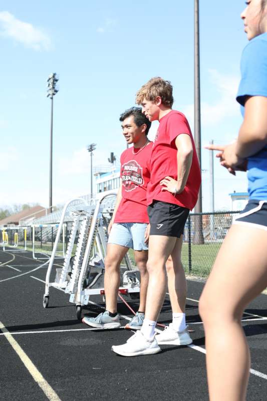 a group of men standing on a track