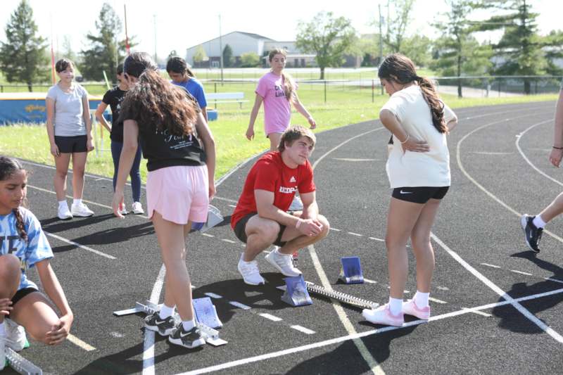 a group of people on a track