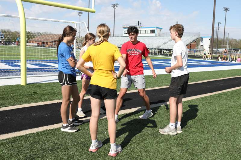 a group of people standing on a field