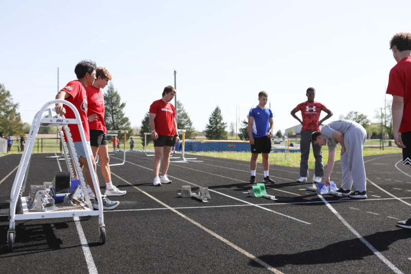 a group of people standing on a track
