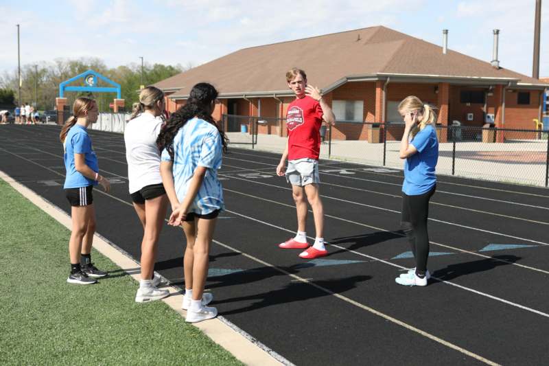 a group of people standing on a track