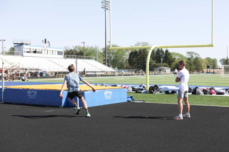 a group of people running on a track