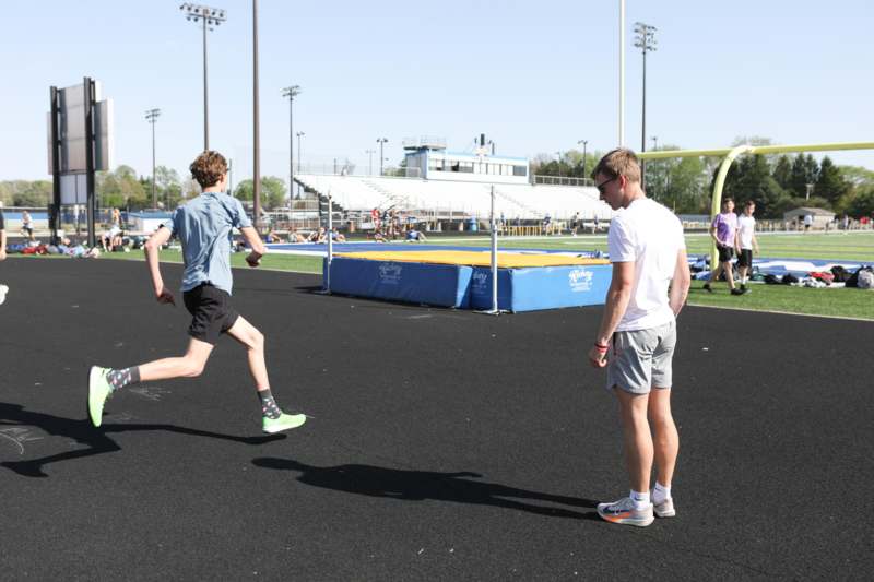 a group of people running on a track