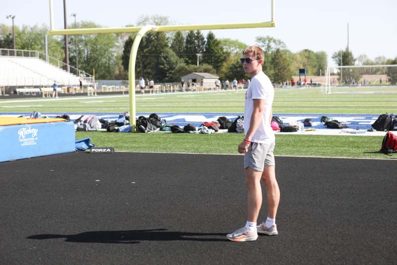 a man standing on a black surface