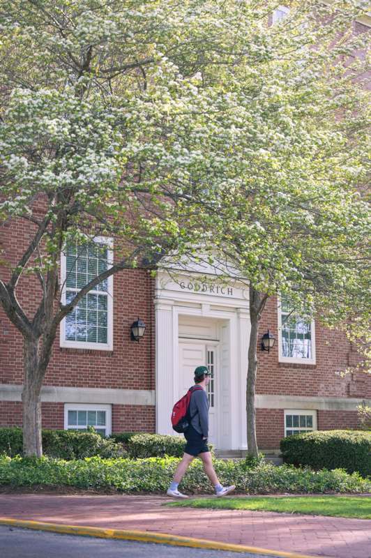 a man walking in front of a building