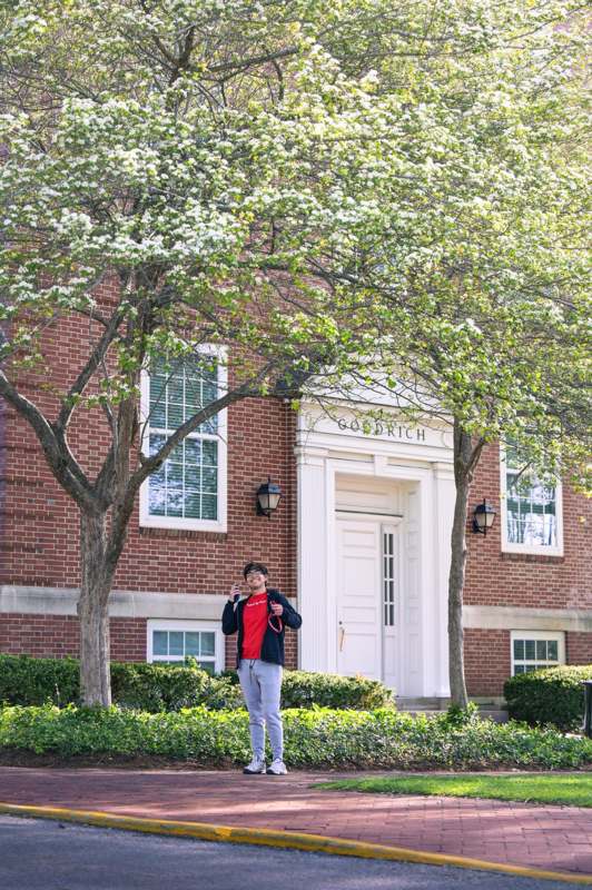 a man standing in front of a building