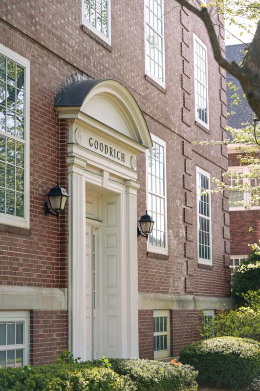 a building with a door and a sign