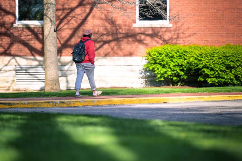 a person walking on the sidewalk