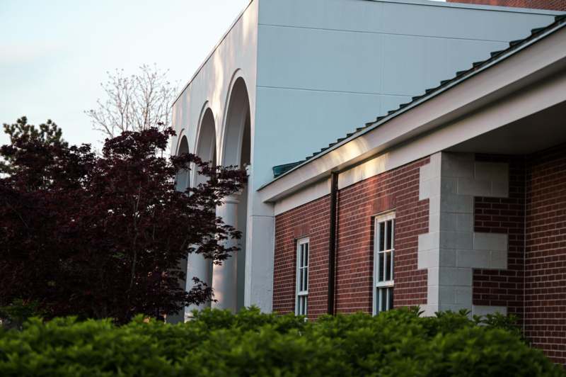a building with a tree in the background