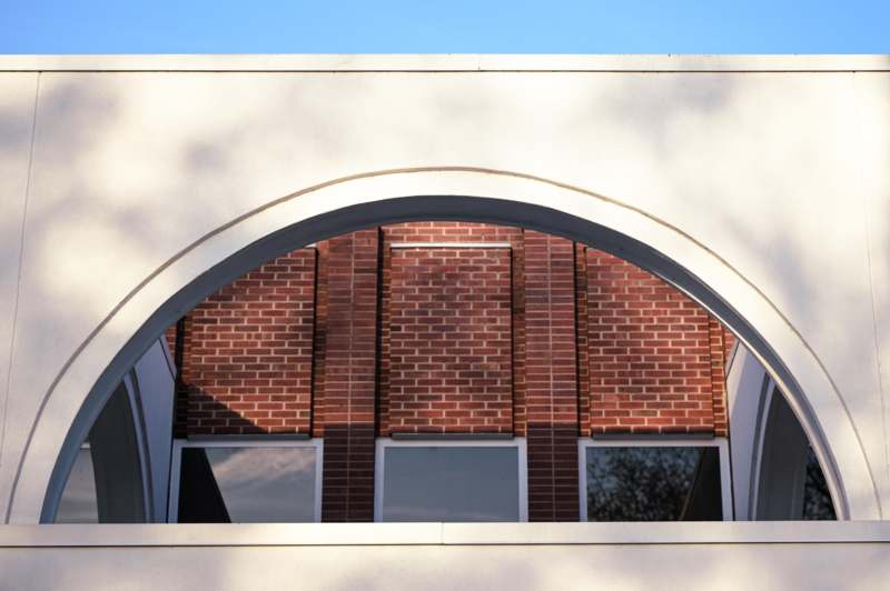 a white building with a arched window