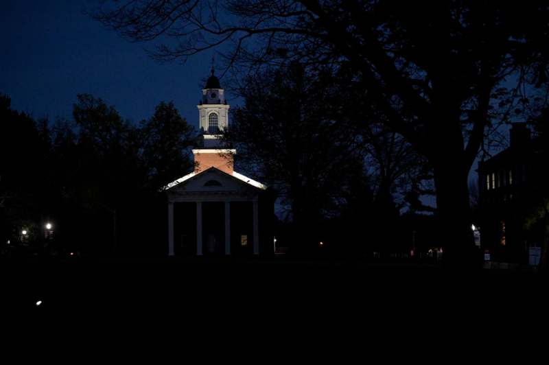 a building with a tower at night