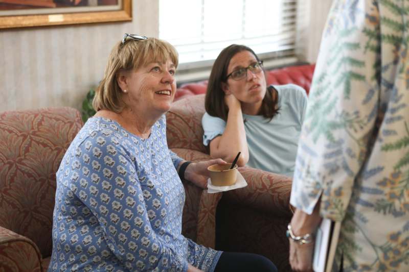 a group of women sitting on a couch