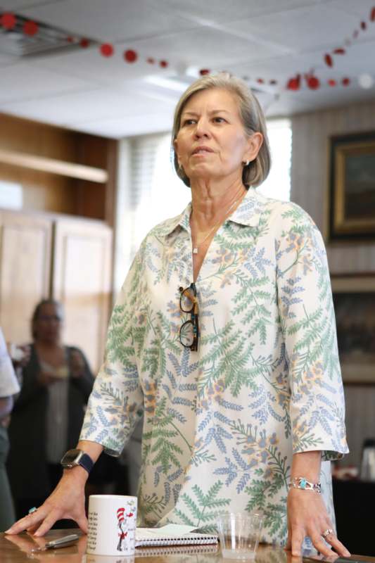 a woman in a floral shirt